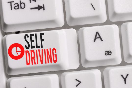 Conceptual hand writing showing Self Driving. Concept meaning Autonomous vehicle Ability to navigate without huanalysis input Keyboard with note paper on white background key copy space