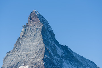 Close-up of the peak from the mountain Matterhorn, Zermatt, Valais, Switzerland, on a perfect summer day, no clouds, blue sky
