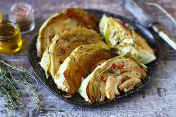 Sliced cabbage baked with herbs and spices. Vegan diet. Healthy snack. Keto friendly.