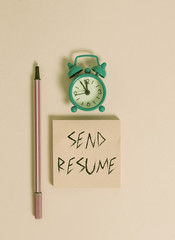 Text sign showing Send Resume. Business photo text brief account demonstratings education qualifications and occupations Metal vintage alarm clock wakeup blank notepad marker colored background