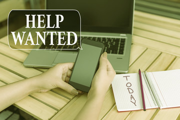 Word writing text Help Wanted. Business photo showcasing advertisement placed in newspaper by employers seek employees woman laptop computer smartphone office supplies technological devices
