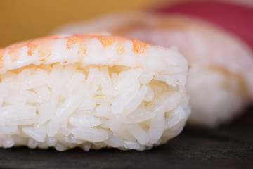 details of a shrimp nigiri, other nigiri on background