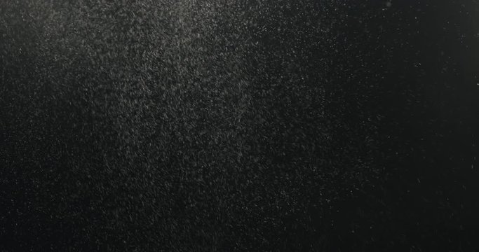 Slow motion closeup man clapping hands with fine powder