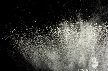 explosion of colored powder on a black background, freezing macro