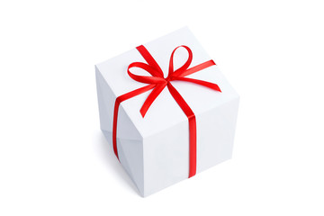 Top view of a white square gift box ready for overlaying a texture or pattern with a red satin bright ribbon with a bow isolated on a white background.