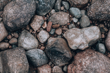 Stones. Photo background with stones. Stony ground view from above.