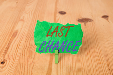 Text sign showing Last Chance. Business photo showcasing final opportunity to achieve or acquire something or action Empty reminder wooden floor background green clothespin groove slot office
