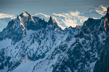 Obraz premium View from Aiguille du Midi, France. Skiers going down on Mer de Glace .