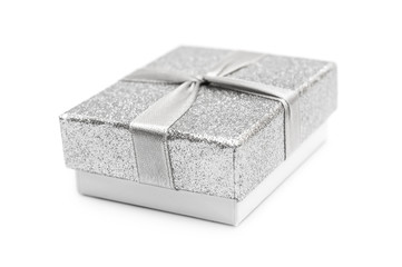 Small silver gift box on white.