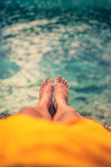 Man lying and enjoying on a sandy tropical beach.