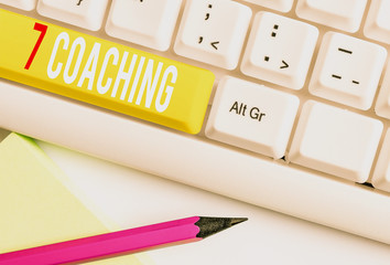 Handwriting text writing 7 Coaching. Conceptual photo Refers to a number of figures regarding business to be succesful White pc keyboard with empty note paper above white background key copy space