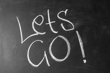 inscription Lets go on chalkboard