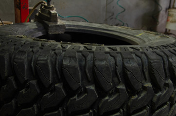 Fototapeta premium work of the master on tire fitting equipment