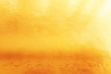 background of gold foil texture with light reflections