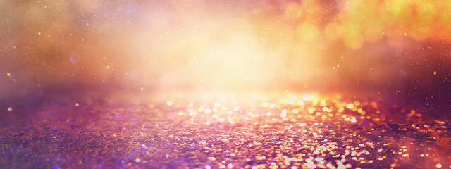 abstract glitter pink, purple and gold lights background. de-focused. banner