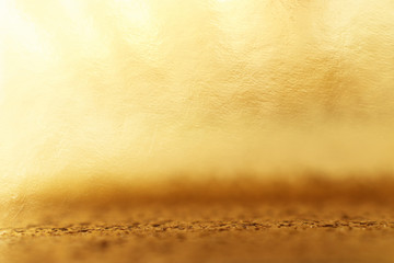 background of gold foil texture with light reflections