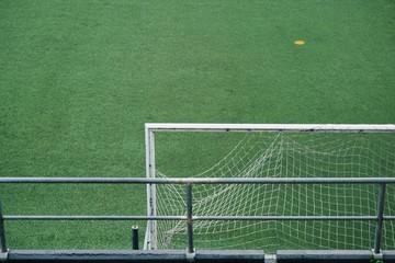 empty soccer field, green grass int he stadium