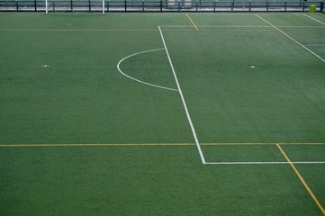 empty soccer field, green grass int he stadium