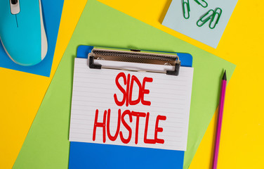 Word writing text Side Hustle. Business photo showcasing way make some extra cash that allows you flexibility to pursue Clipboard striped sheets marker clips notepad mouse colored background