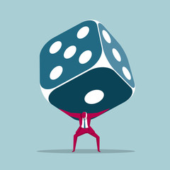 Businessman carrying huge dice. Isolated on blue background.