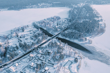 Aerial view of the road crossing the river in winter