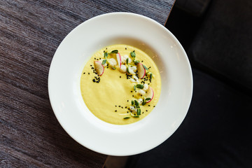 yellow cream soup white plate