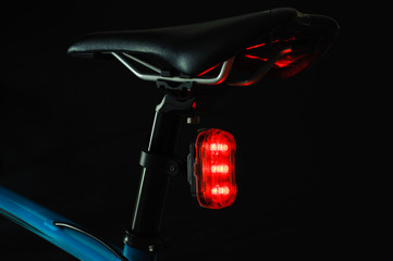 Close-up of illuminated bicycle tail light - Powered by Adobe