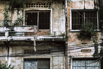 abandoned house with decadent facade with moss in Phnom Penh in cambodia