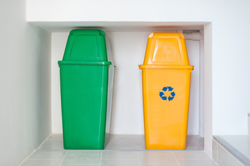 Colorful recycle bins on the floor. Waste disposal in apartment buildings