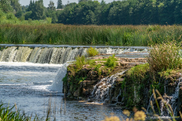 Fototapeta na wymiar Panoramic shot of wide waterfall