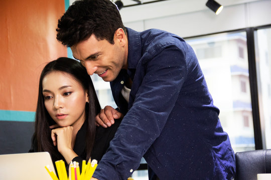 Close-up Creative person meeting and looking product in the office.