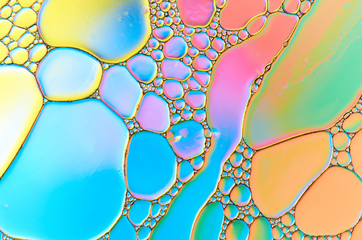 Colorful abstract images of oil drops on water. Colored circles and waves as a concept of...