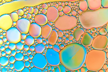 Colorful abstract images of oil drops on water. Colored circles and waves as a concept of...