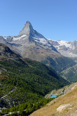 Fototapeta premium Amazing View of the mountain Matterhorn, Zermatt, Valais in the Swiss Alps, blue sky, no clouds in early autumn.