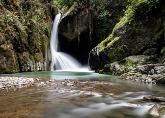 Savegre river waterfall, San Gerardo de Dota, Costa Rica. Low shutter speed stream. yoga concept.