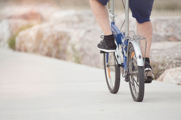 Fototapeta premium senior strolling with his folding bike