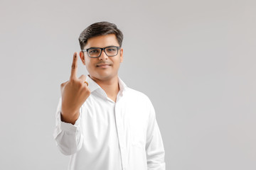 Young Indian voter showing finger 