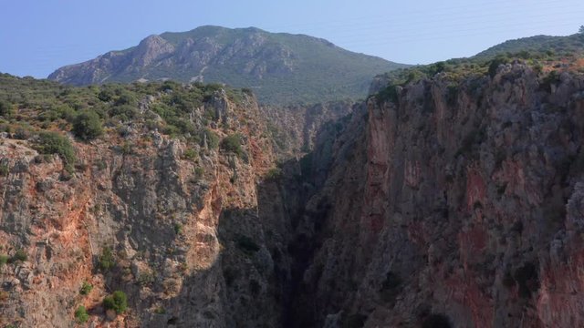  Deep mountain gorge. Aerial view. Close-up.