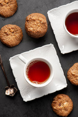 cup of hot tea and and cookies