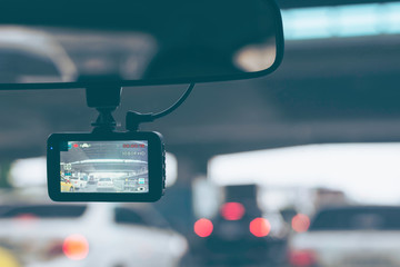 Car camera or car DVR recording traffic and another cars on the road 