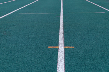 blue and white line floor texture of running lane in sport stadium
