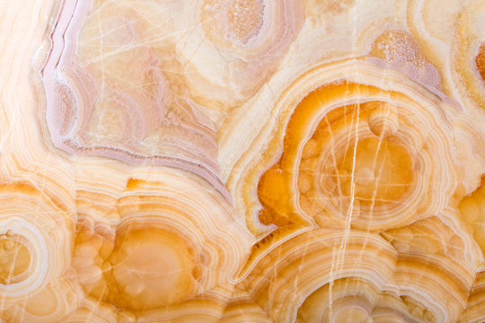 Contrast onice background in beige tone for expensive design. High quality texture.