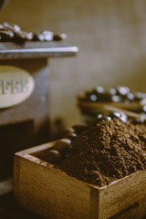 still life with coffee beans and old coffee mill on the rustic background