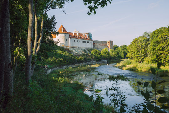 City Bauska, Latvia Republic. Park with old castle and river. Trees and green zone. Sep 9. 2019 Travel photo.