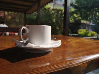 A cup of coffee on the table of a street cafe