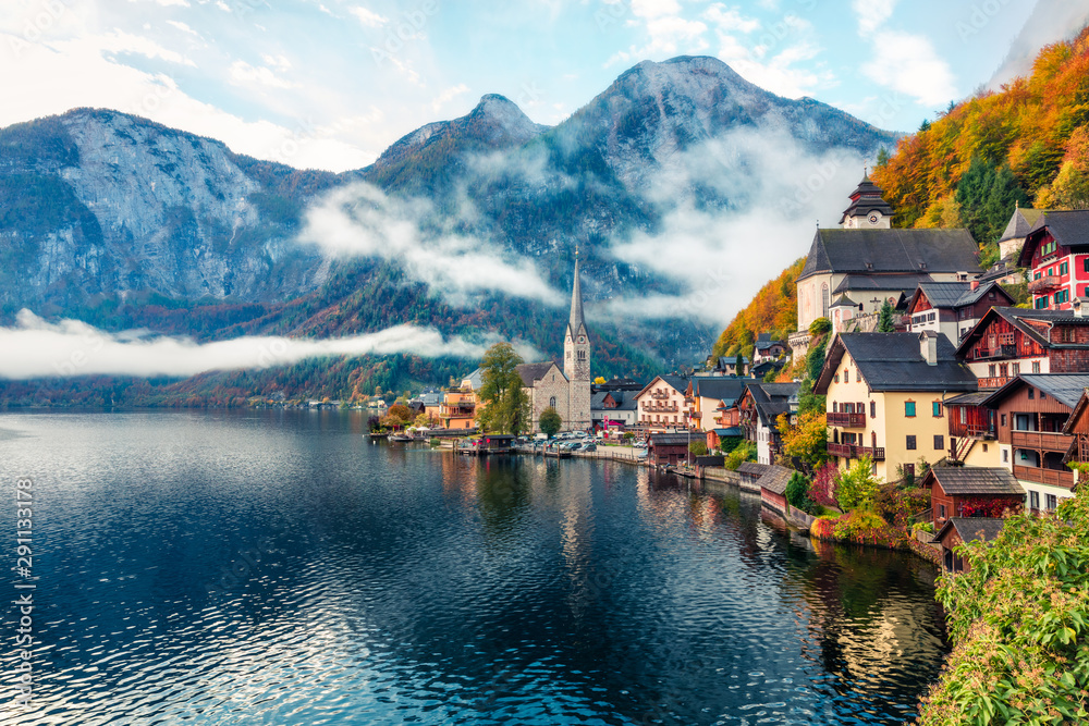 Wall mural misty autumn scene of hallstatt lake. splendid morning viev of hallstatt village, in austria's mount
