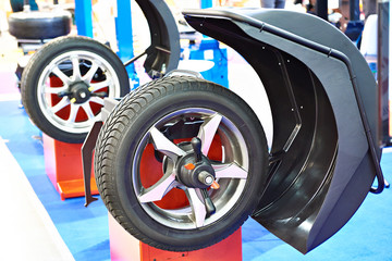 Stand for balancing wheels of car