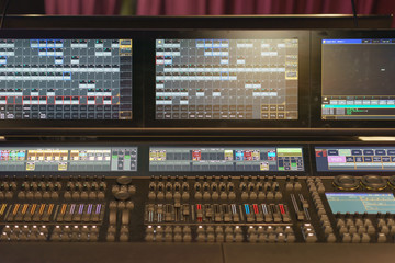 Photography of the modern premium stage mixed board / desk. Close frontal view.