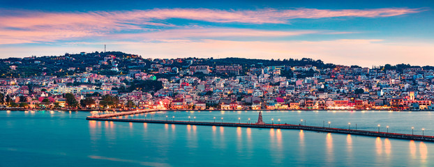 Fototapeta na wymiar Panoramic evening cityscape of Argostolion town, former municipality on the island of Kefalonia, Ionian Islands, Greece. Impressive spring seascape of Ionian Sea. Traveling concept background.