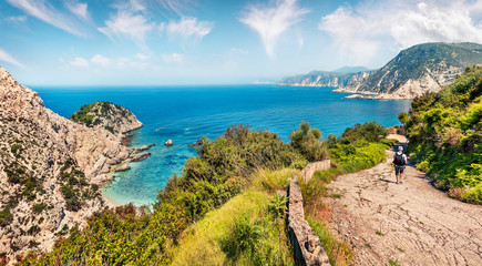 Old road to Agia eleni beach. Sunny morning seascape of Mediterranean Sea. Colorful outdoor scene...